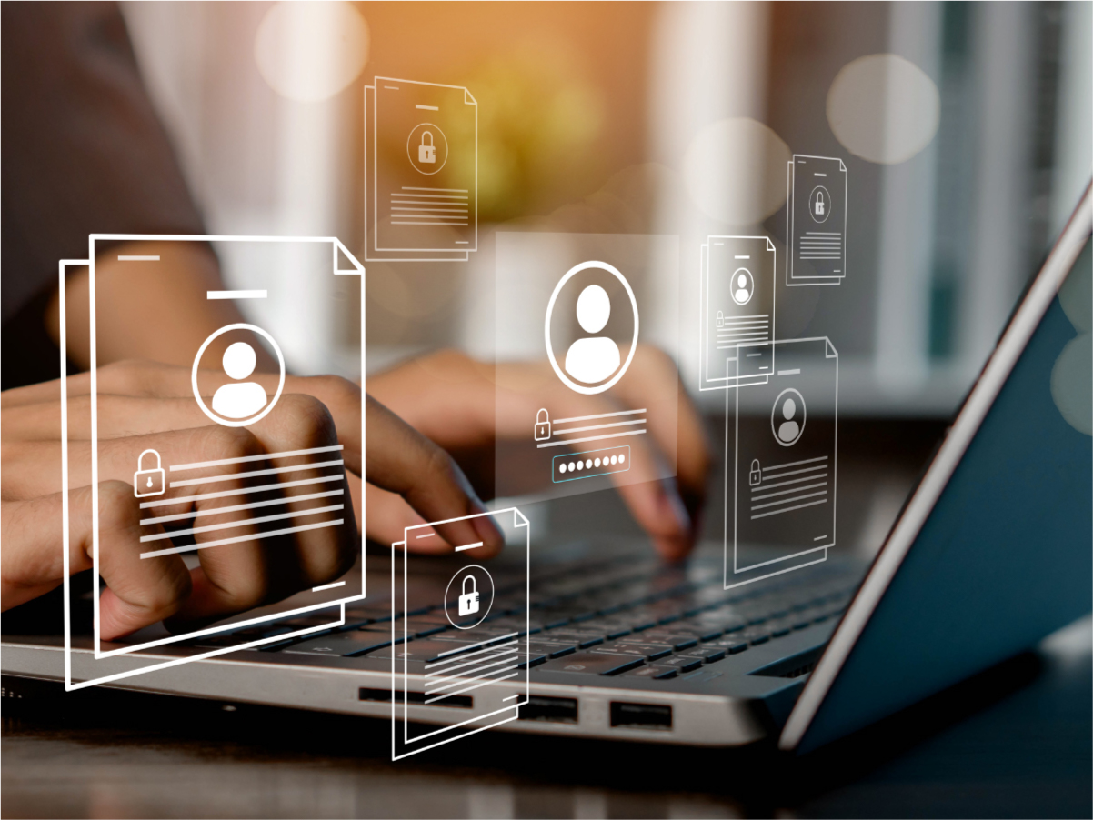 Person typing on laptop and encryption file icons placed over image